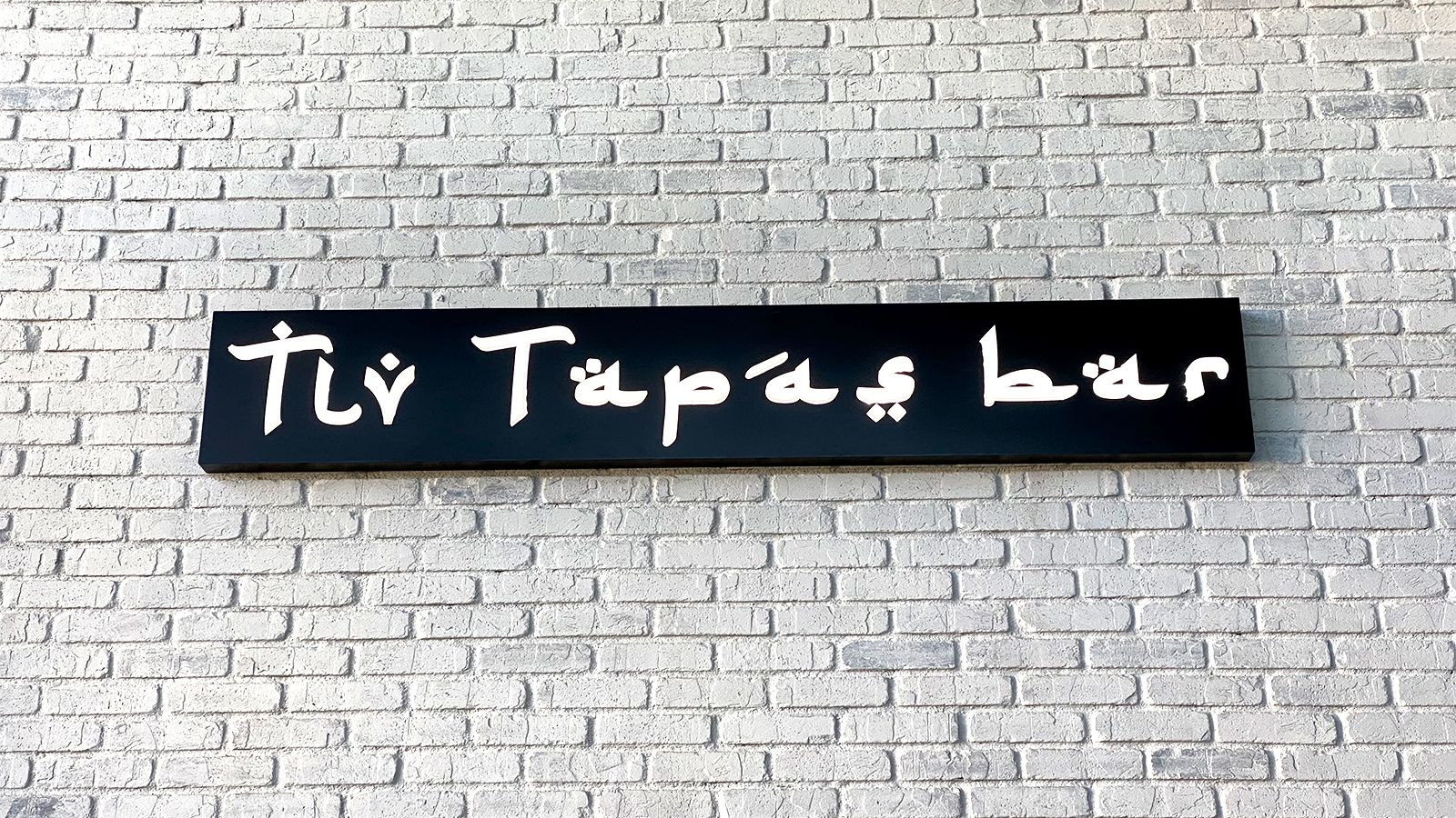 Tly tapas bar restaurant sign