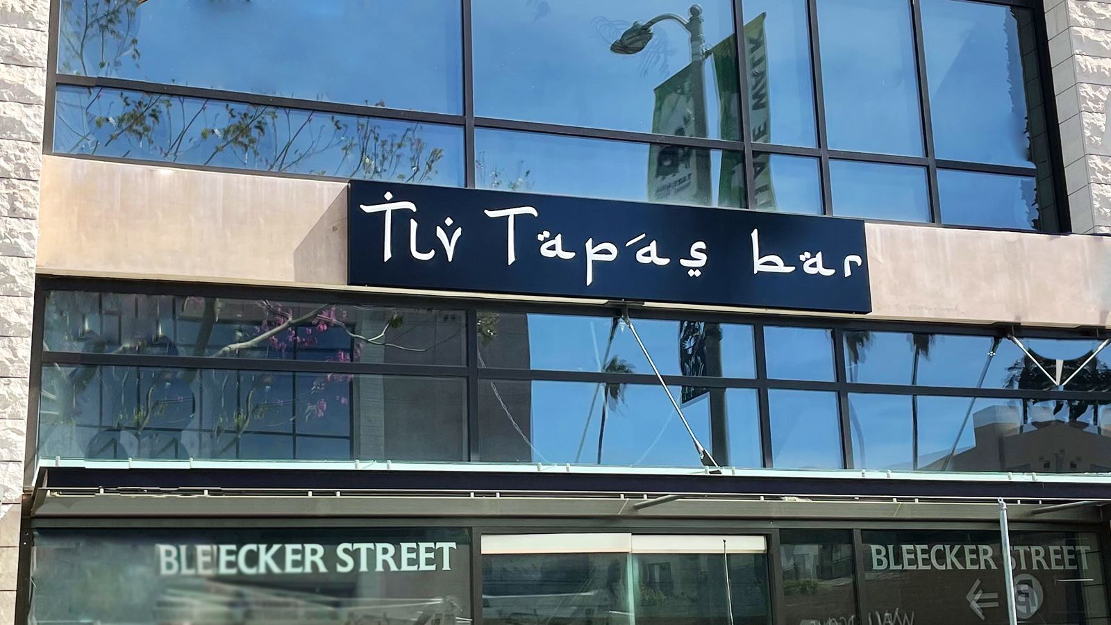 Tly tapas bar restaurant signs