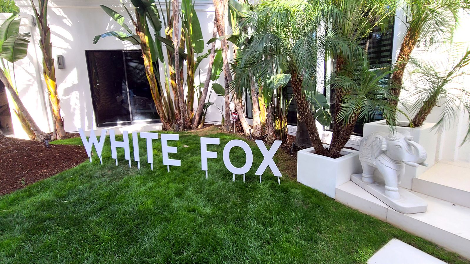 White fox yard sign
