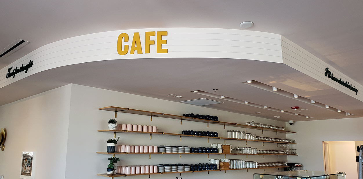 Cafe interior branding design with golden letters