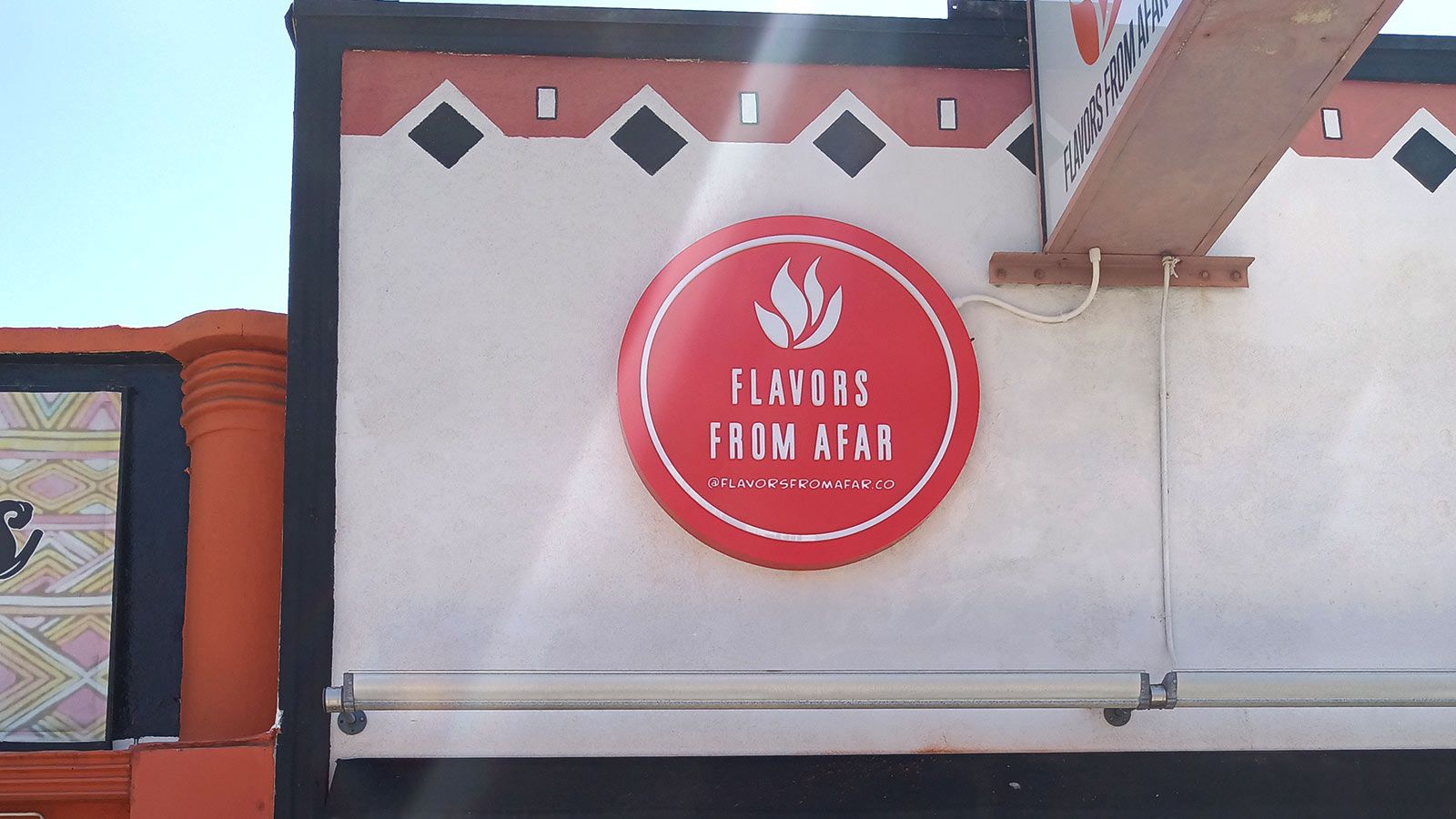 flavors from afar outdoor sign
