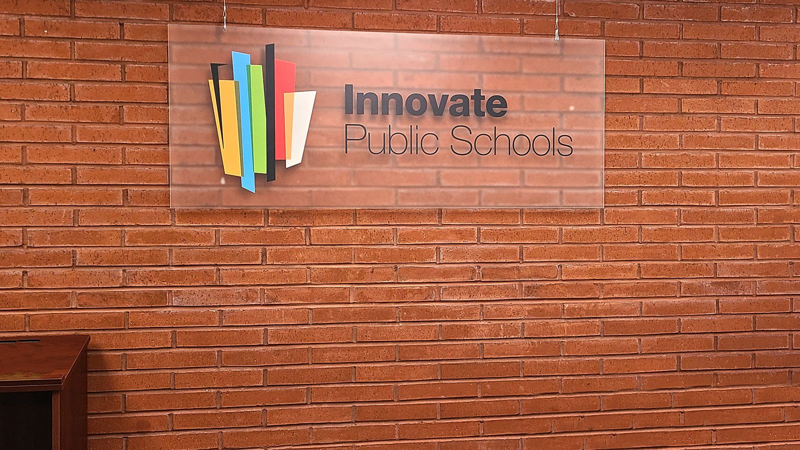 innovate public schools acrylic sign