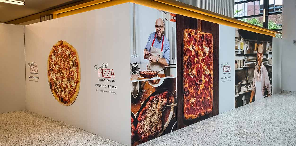 Restaurant interior branding with large prints of pizzas