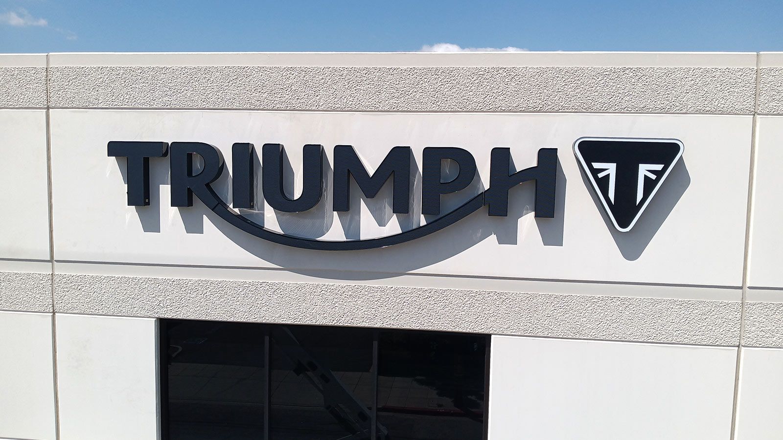 triumph high rise sign