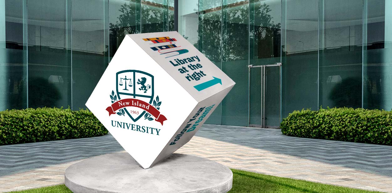 Custom campus branding cube solution in white placed in front of the building