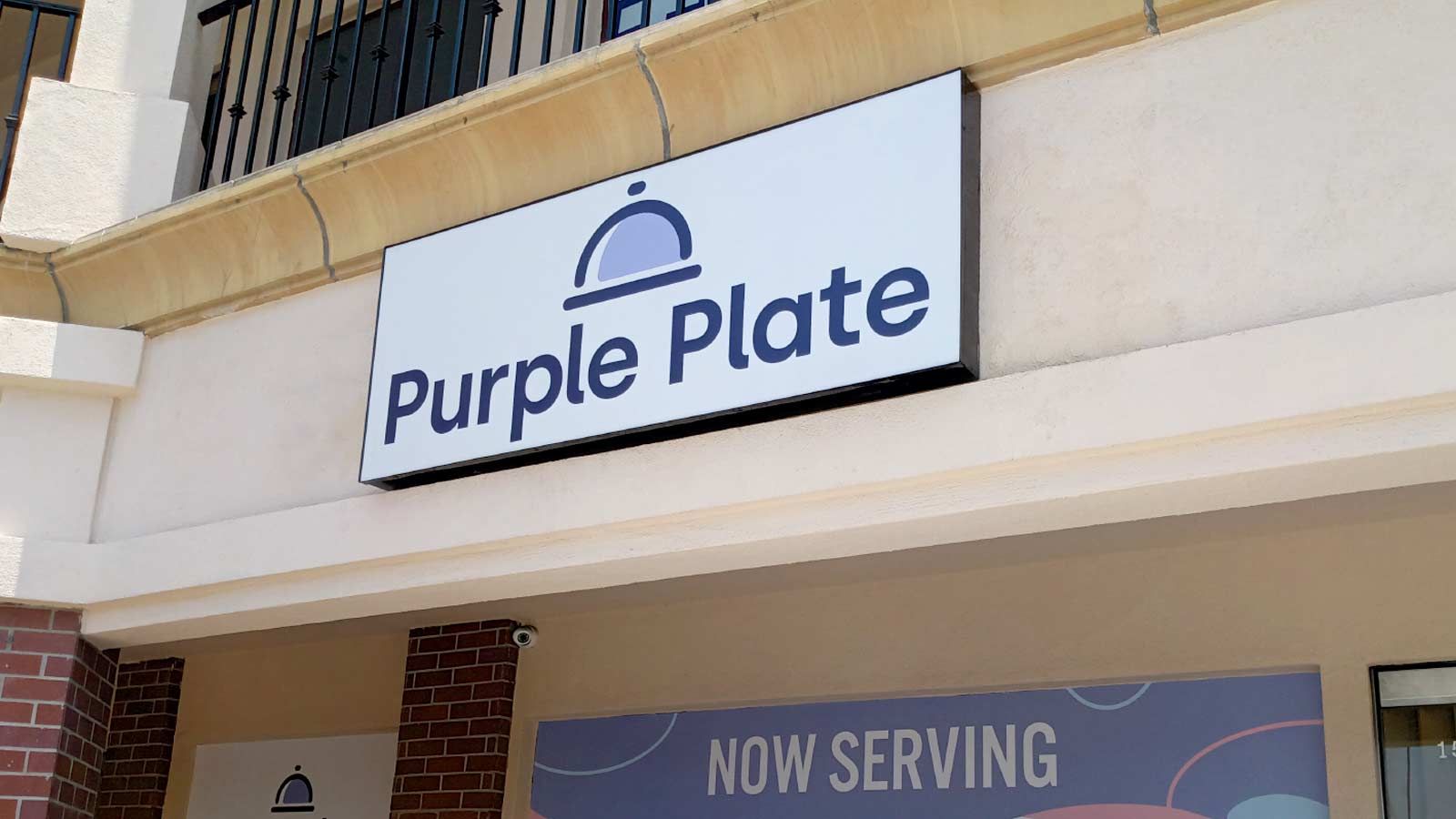 purple plate outdoor illuminated box sign
