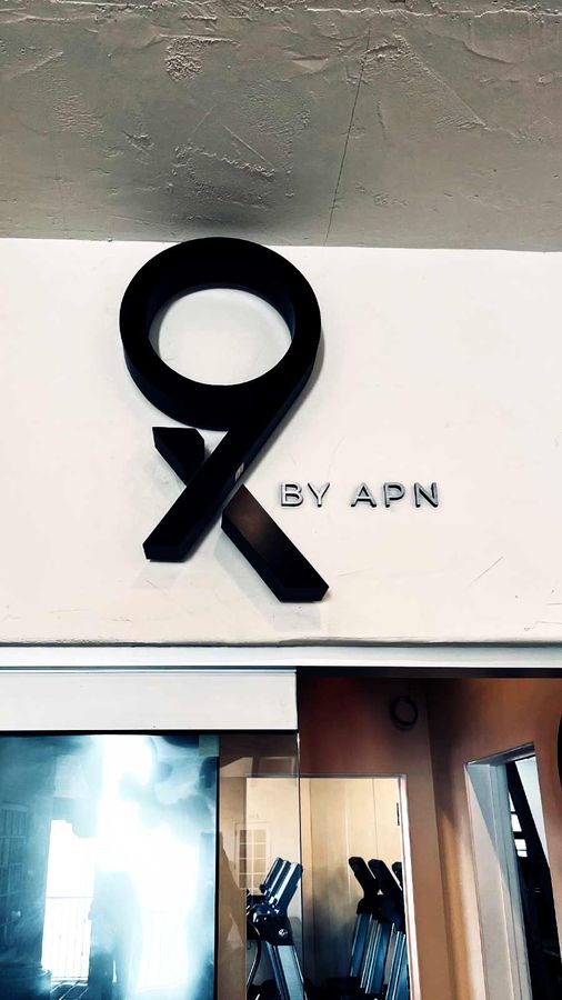 APN Capital wall-mounted light up sign