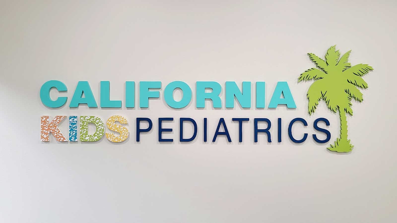 California Kids Pediatrics acrylic sign attached to the wall
