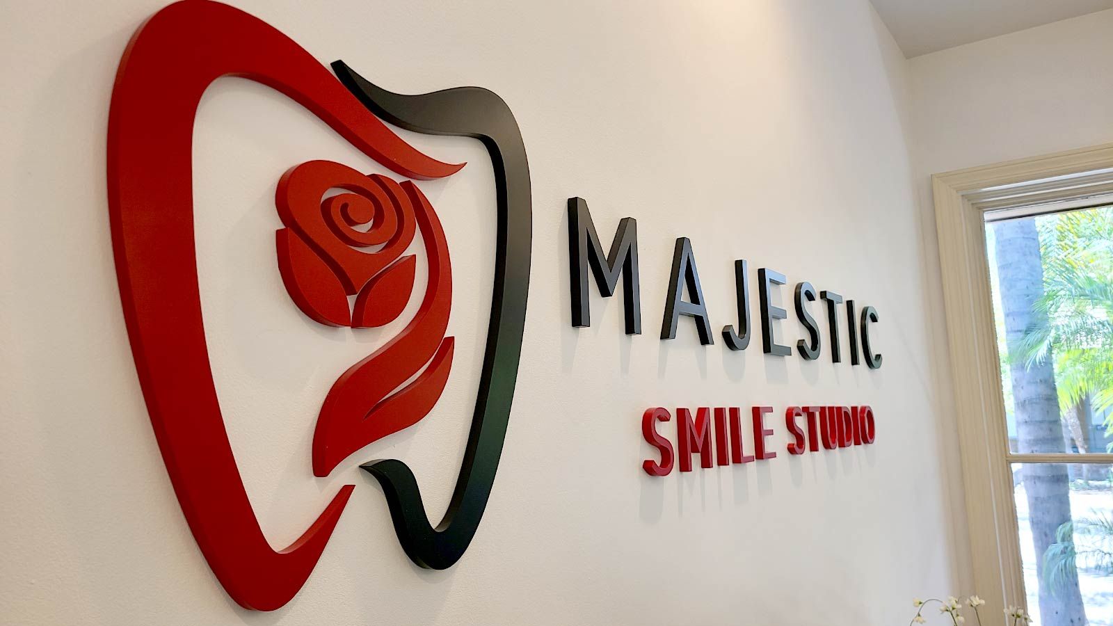 Majestic Smile Studio office sign mounted to the wall