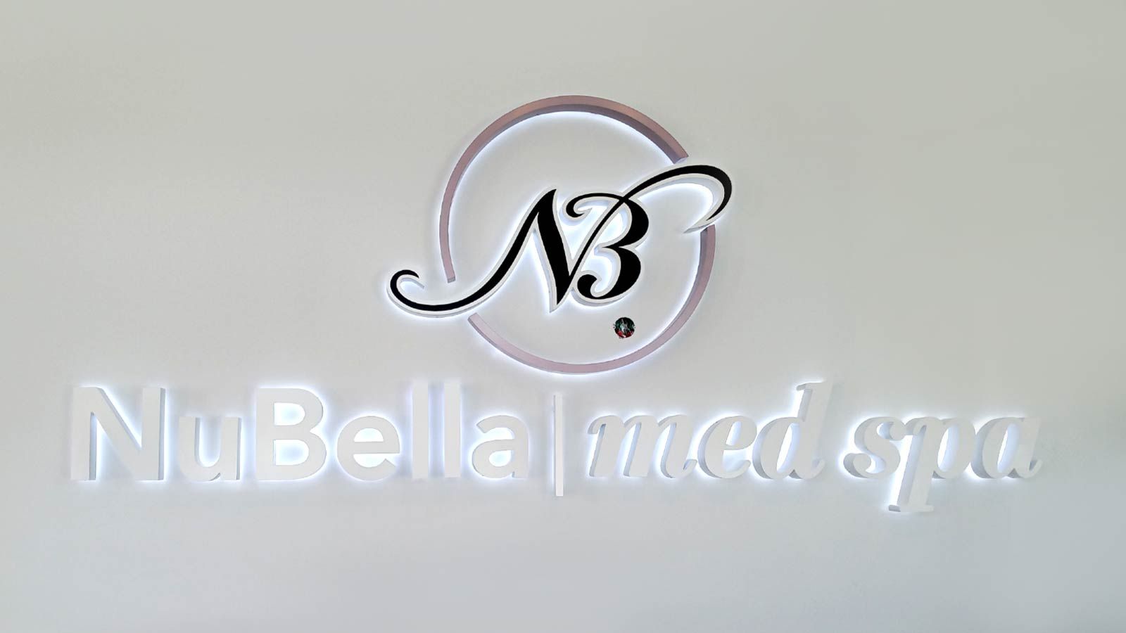 NuBella Med Spa backlit letters installed on the wall