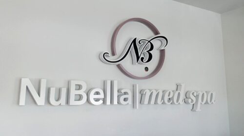 NuBella Med Spa light up letters mounted to the wall