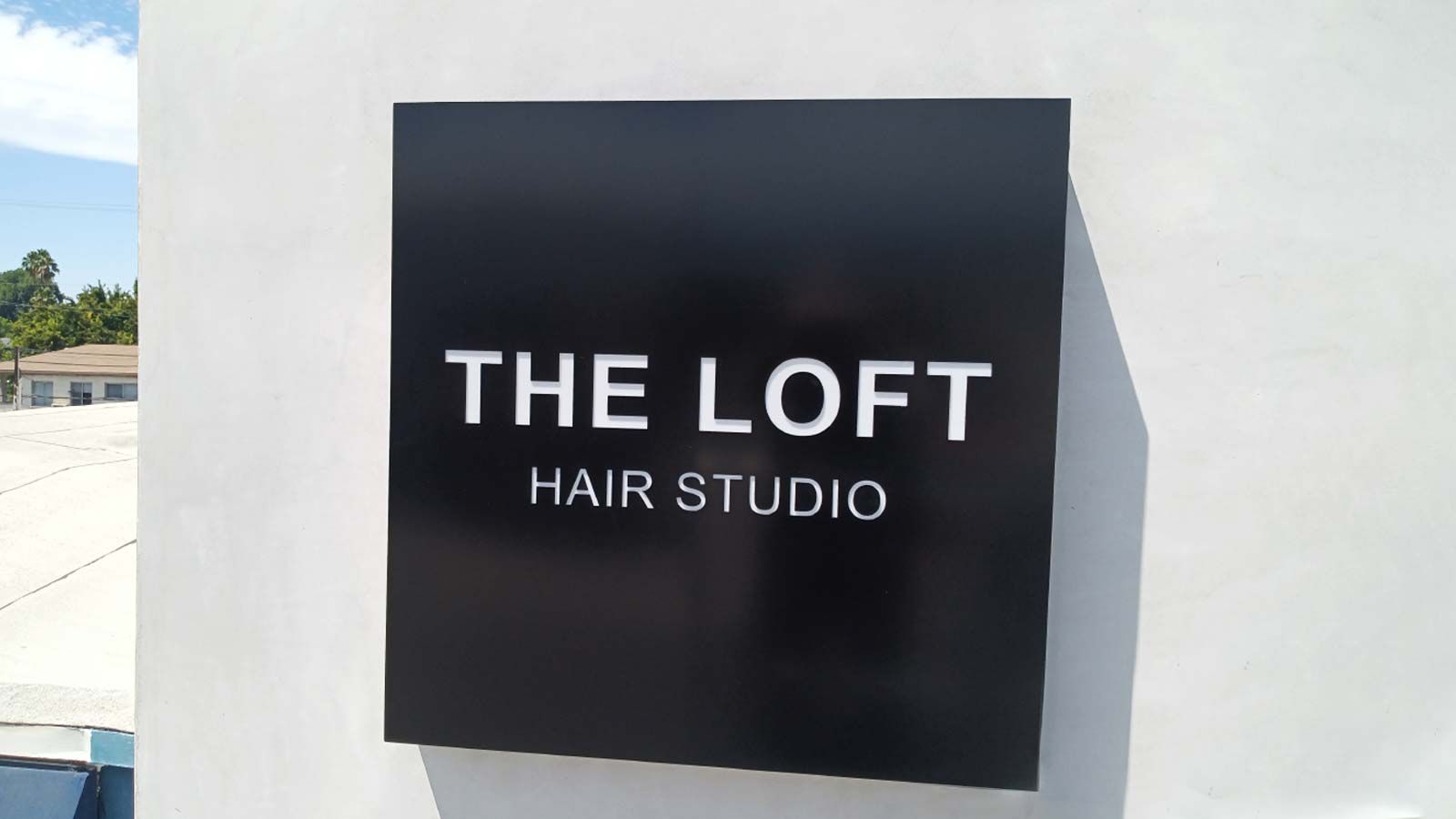 The Loft Hair Studio wall-mounted light up sign