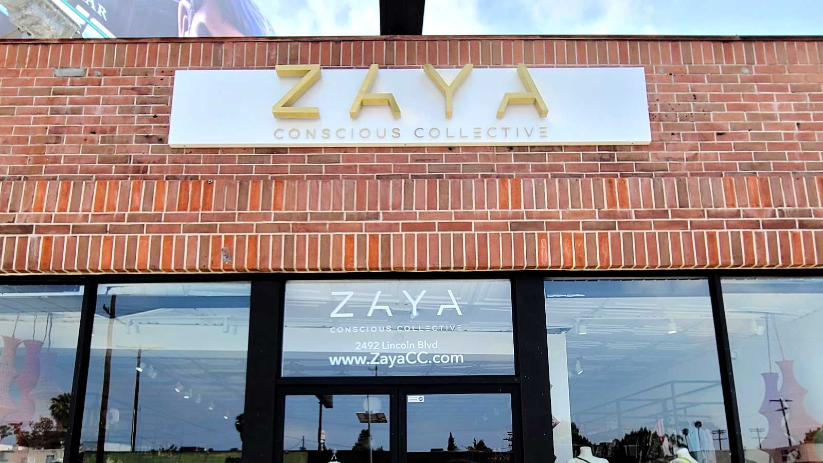 ZAYA Conscious Collective store sign mounted on the facade