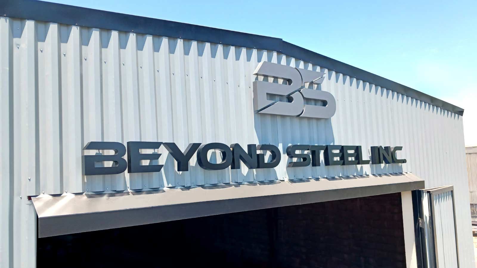 Beyond Steel Inc. backlit letters on the building