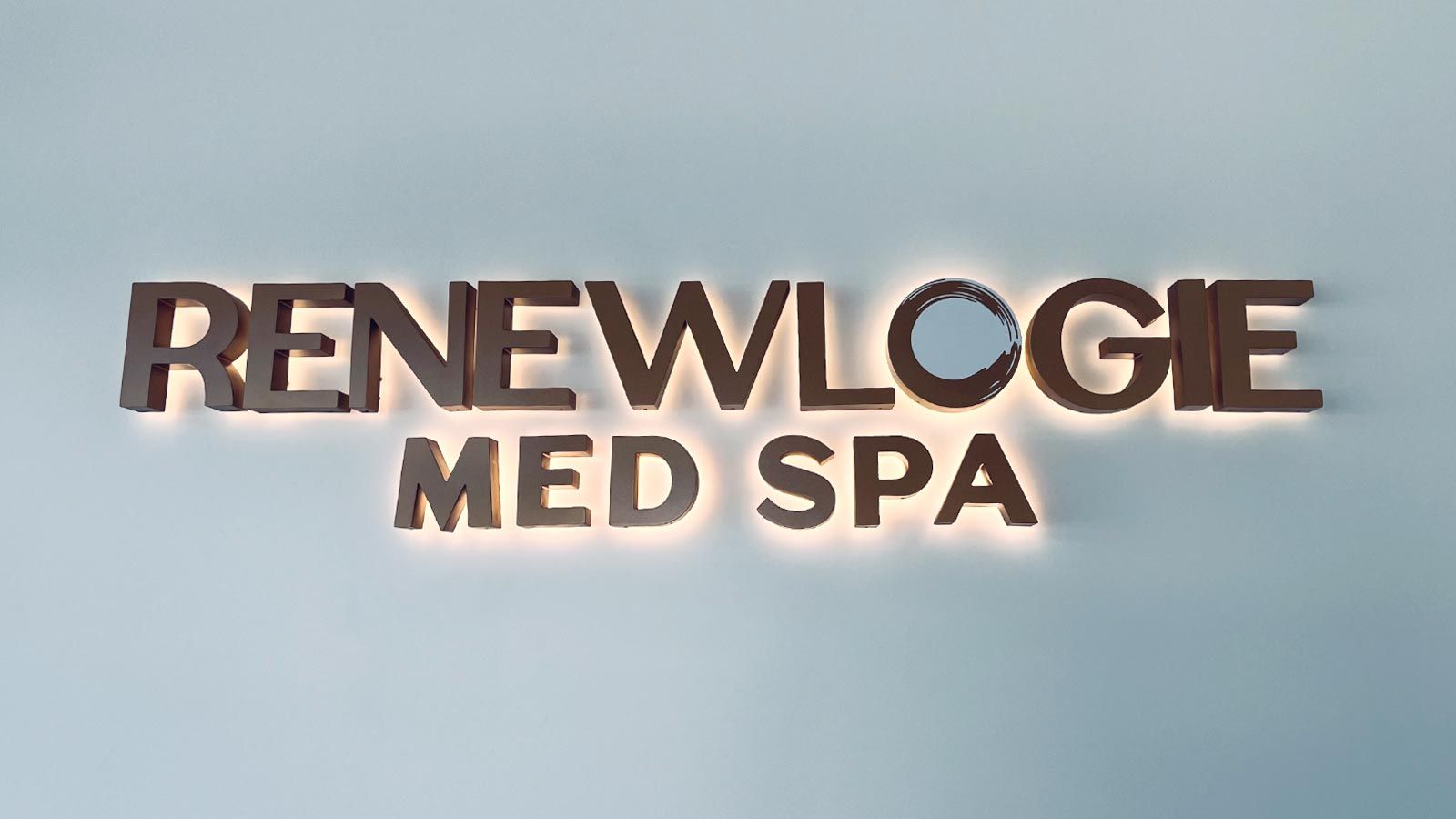 Renewlogie Med Spa backlit letters mounted to the wall