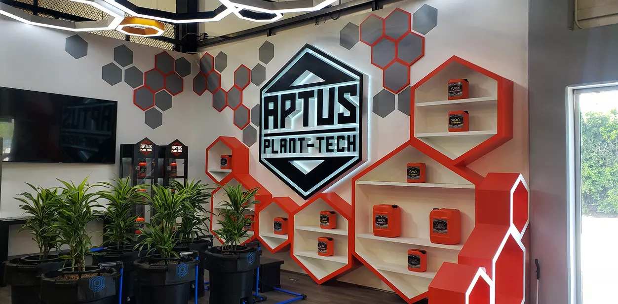 Aptus Plant-Tech in store branding wall display with custom shapes