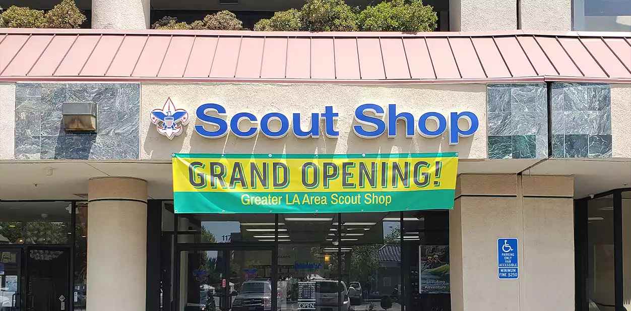 Scout Shop store branding logo and brand name displays in blue and white