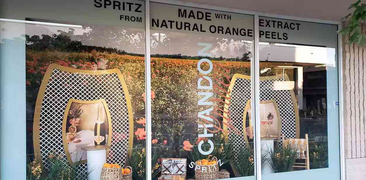 Chandon store window branding with brand name display and custom decors