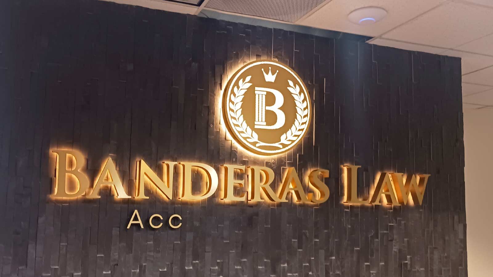 Banderas Law light up signs placed on the interior wall