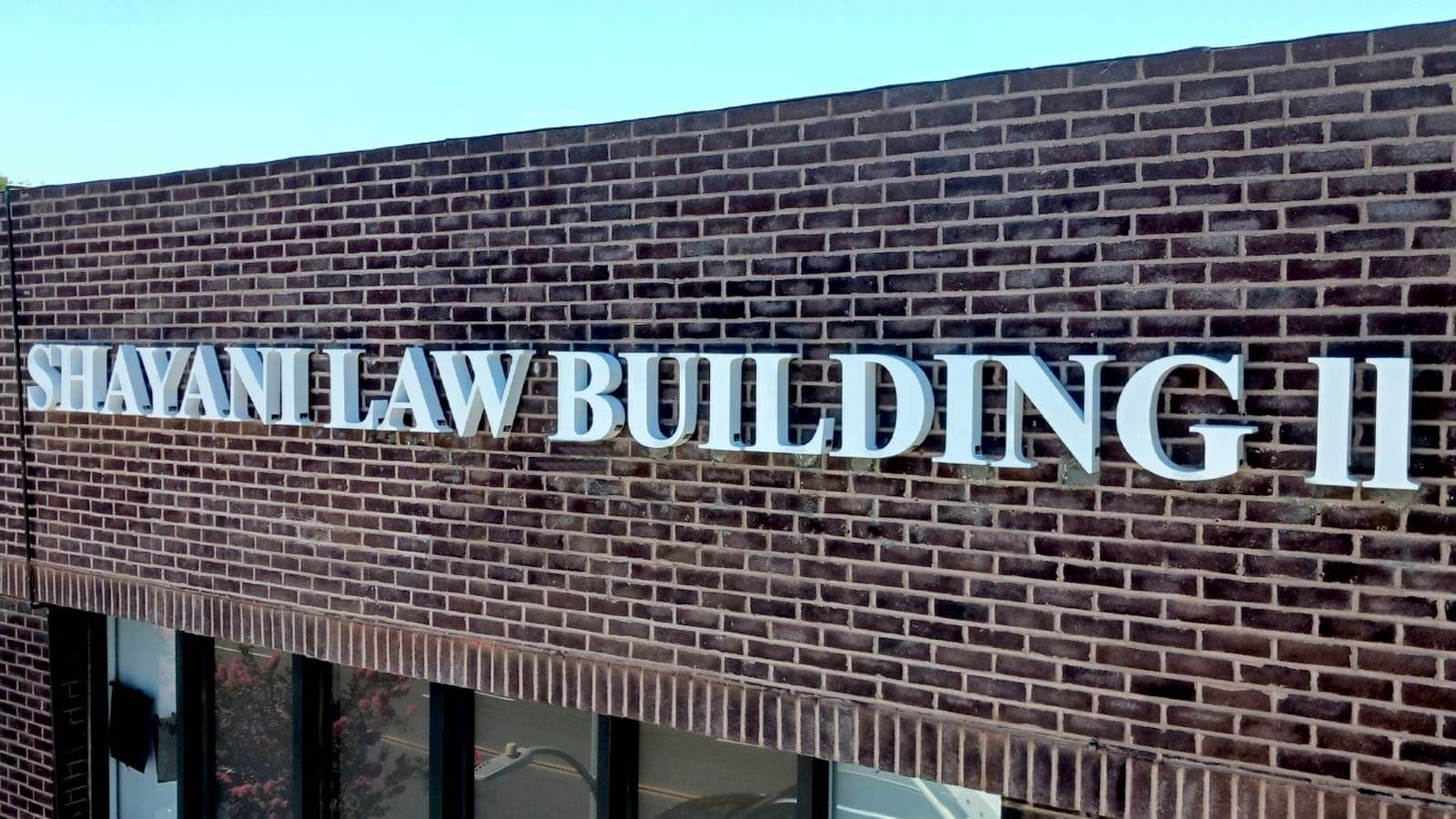 Shayani Law backlit letters mounted on a building facade