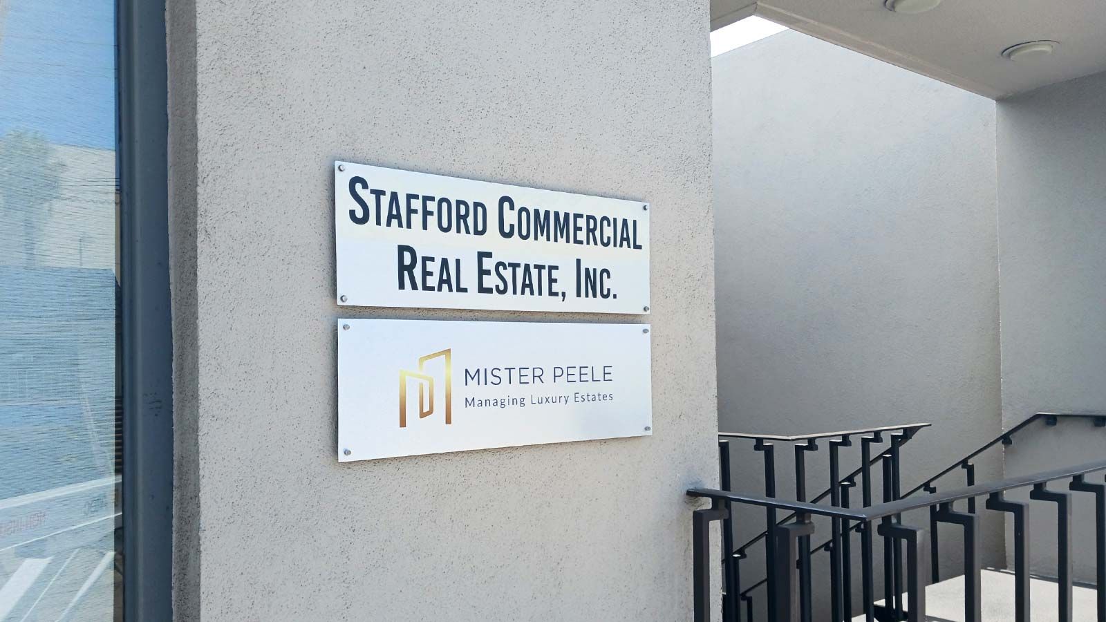 Stafford Commercial Real Estate aluminum sign on the wall