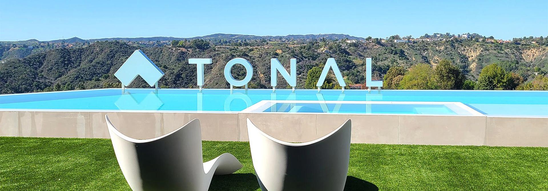 Tonal huge place branding display in white at the pool area