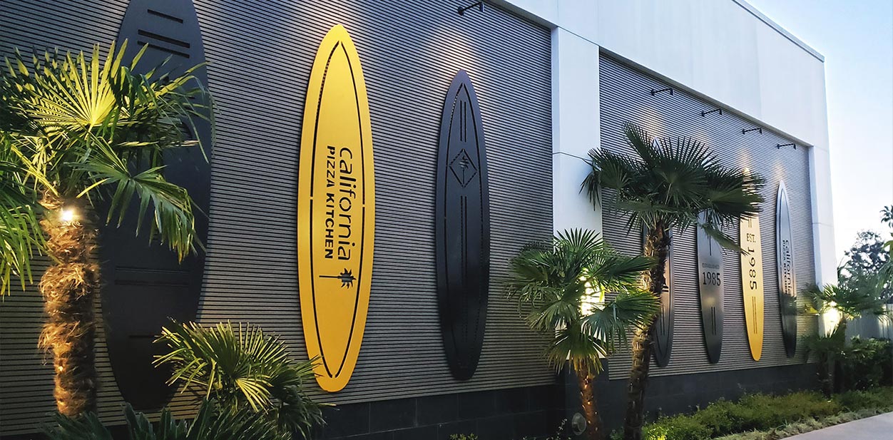 California Pizza Kitchen Restaurant storefront place branding displays in black and yellow