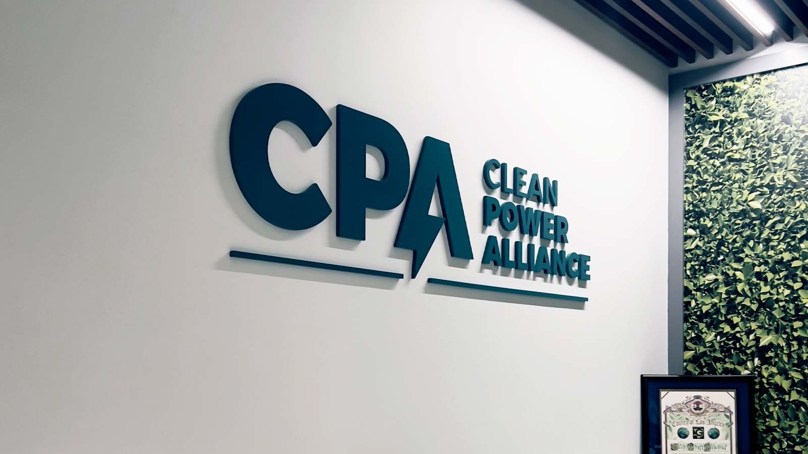 Clean Power Alliance lobby sign applied to the wall