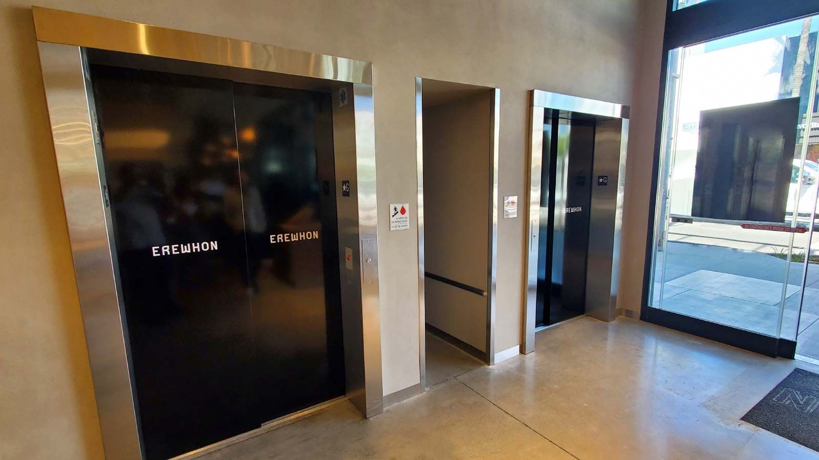 Erewhon vinyl lettering applied to the elevator doors