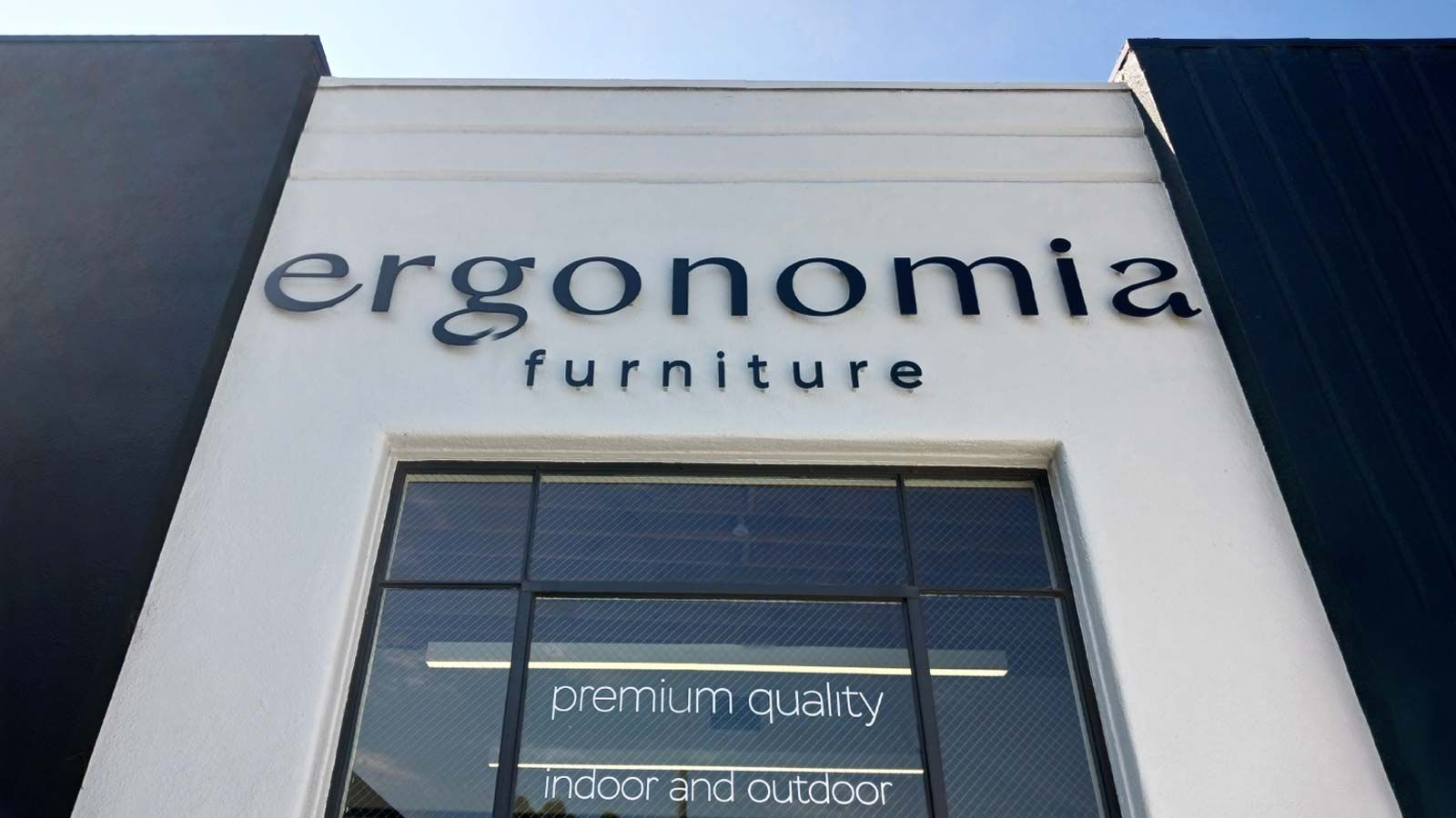 Ergonomia Furniture outdoor sign set up on the wall