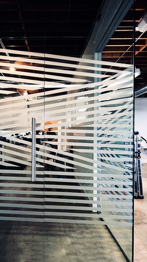Personalized office sign attached to the glass walls
