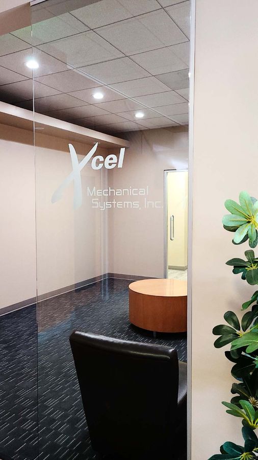 Xcel Mechanical Systems Inc office sign on the glass wall