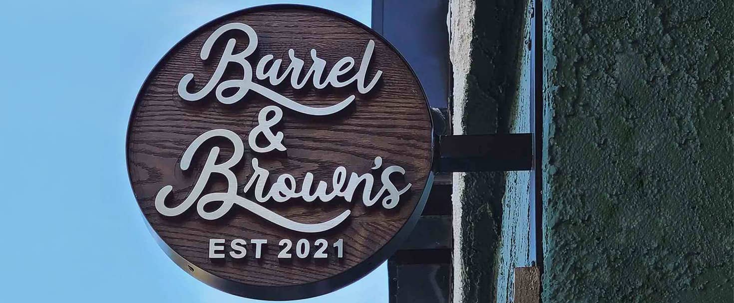Barrel and Browns custom logo sign in a wall blade style made of wood and aluminum for branding