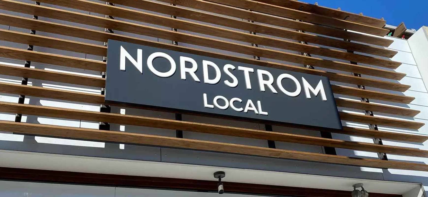 Nordstrom Local logo sign in black and white made of aluminum and acrylic for store branding