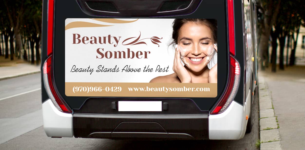 Beauty Somber partial bus branding with the company's slogan and contact information