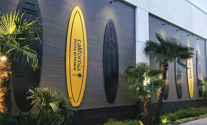 California Pizza Kitchen logo signs in surfboard shapes made of aluminum for outdoor branding