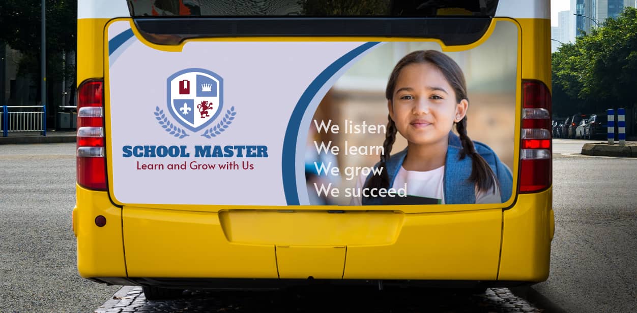 School Master bus branding with the school's logo and motto