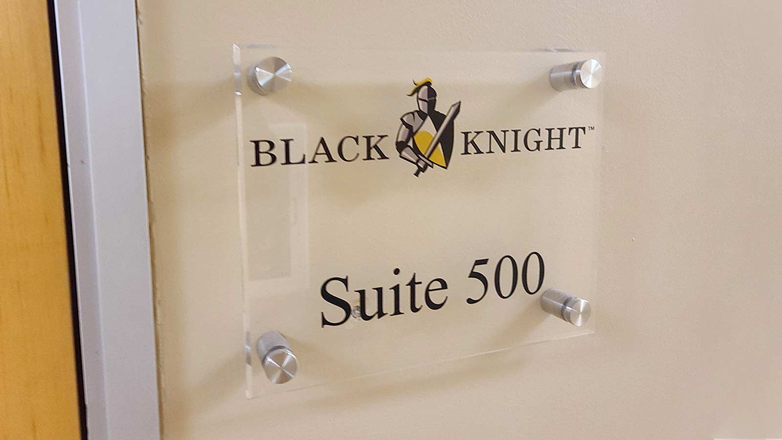 Black Knight office sign placed on the wall
