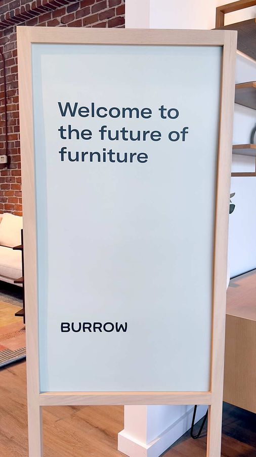 Burrow store sign set up indoors