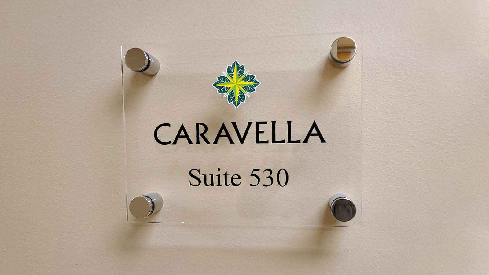 Caravella acrylic sign mounted on the wall