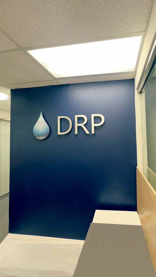 DRP Engineering aluminum sign adhered to the wall