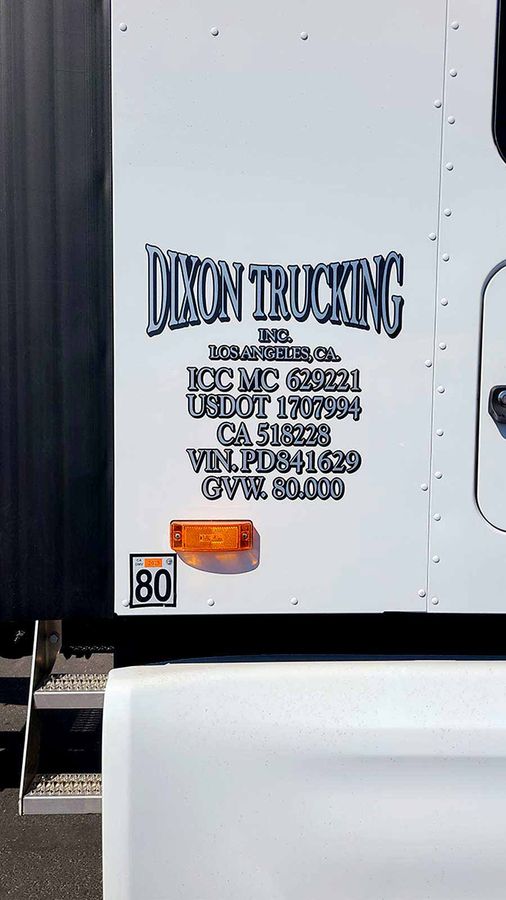 Dixon Trucking INC. vinyl lettering applied to the truck