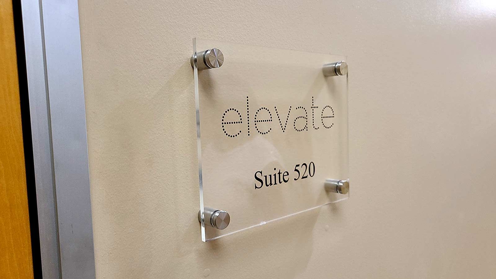 Elevate interior sign attached to the wall