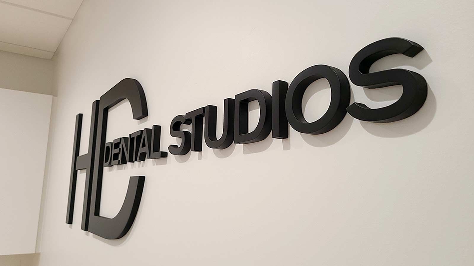 HD Dental Studios 3D sign mounted on the wall