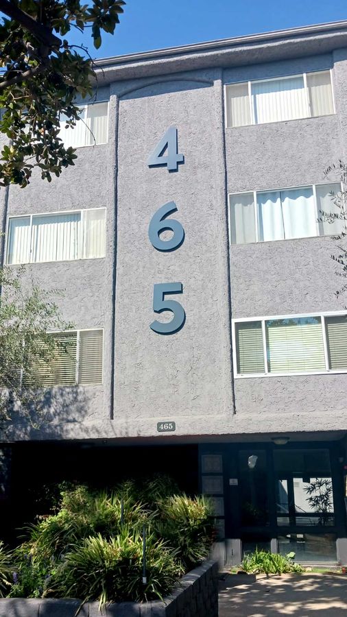 Hyrose Management Inc. outdoor sign attached to the building