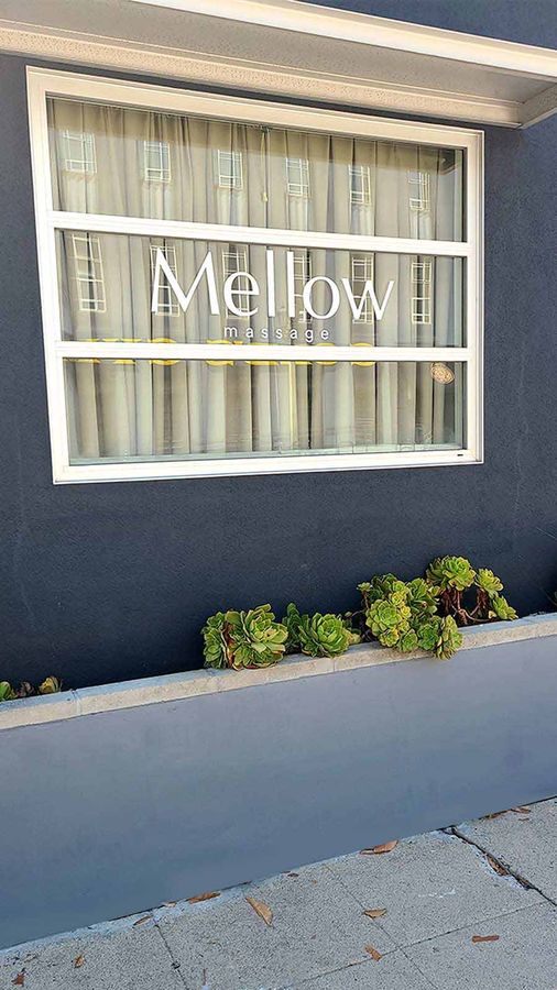Mellow Massage vinyl lettering applied to the window