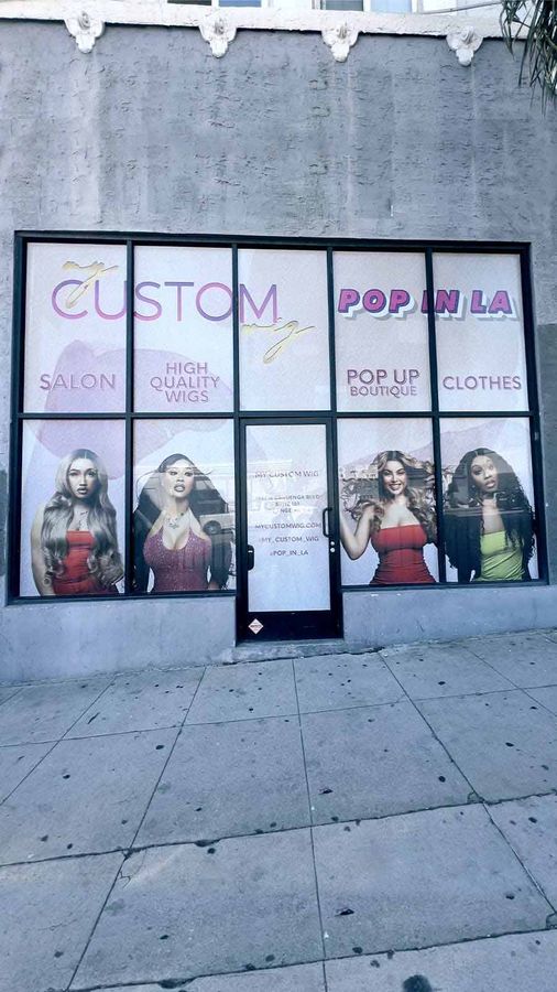 My Custom Wig window decals attached to the storefront