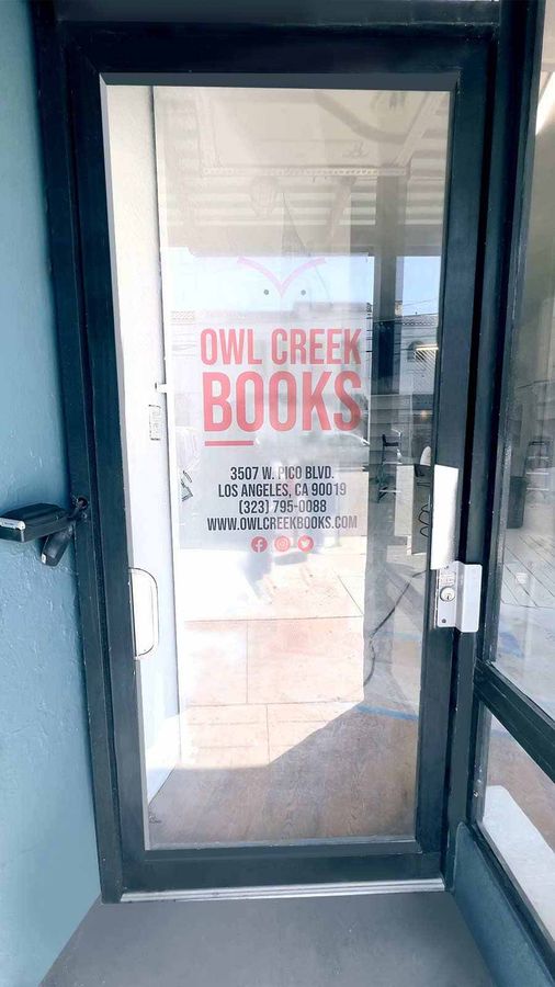 Owl Creek Books vinyl lettering applied to the glass