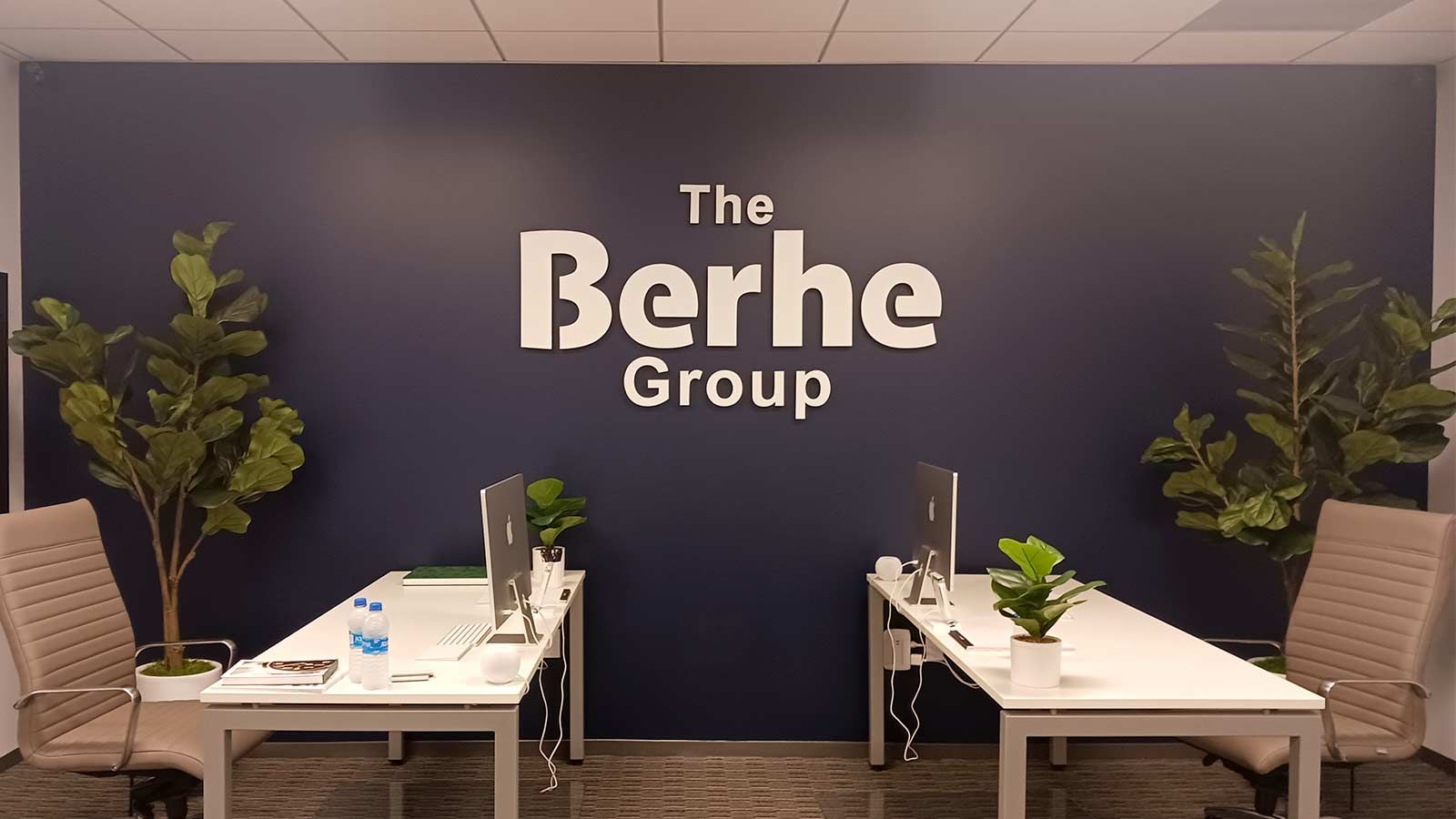 The Berhe Group 3D sign attached to the wall