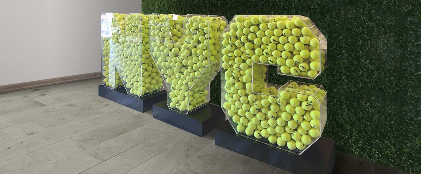 NYC 3D letter sign in a free-standing style filled with balls and made of aluminum and acrylic